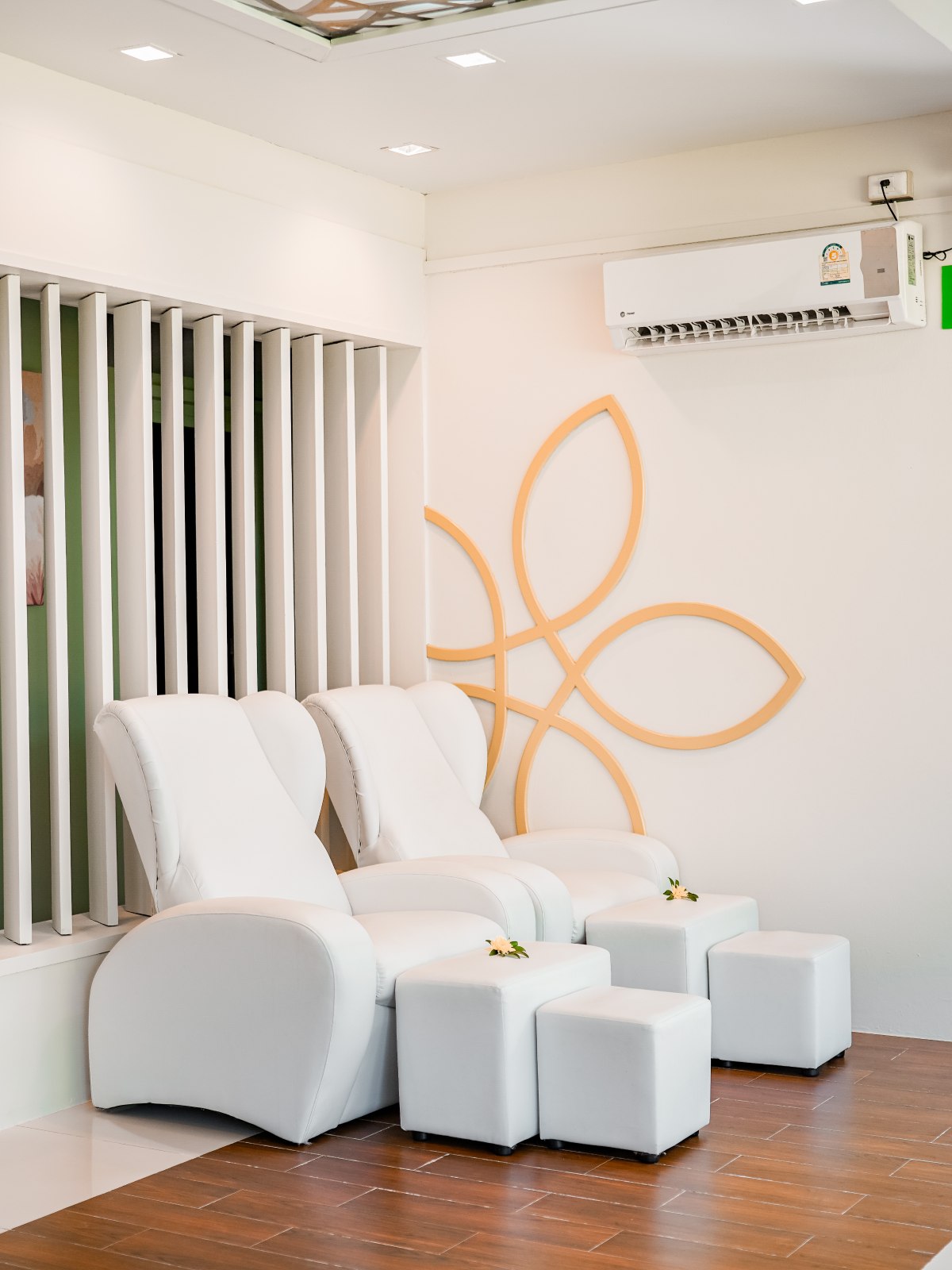 Evening shot of a hotel with a large pool, pool bar and palm trees reflected in the water.