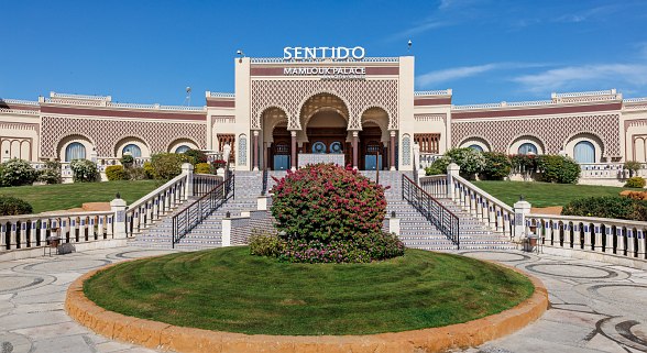 Relax with a scented candle, soothing soap, and soft rolled towels—perfect for a calming spa experience.